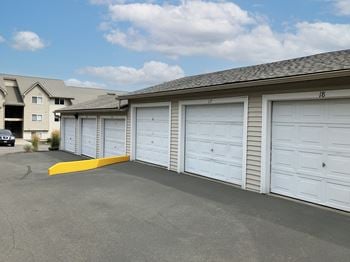 A row of garage doors on the side of a building